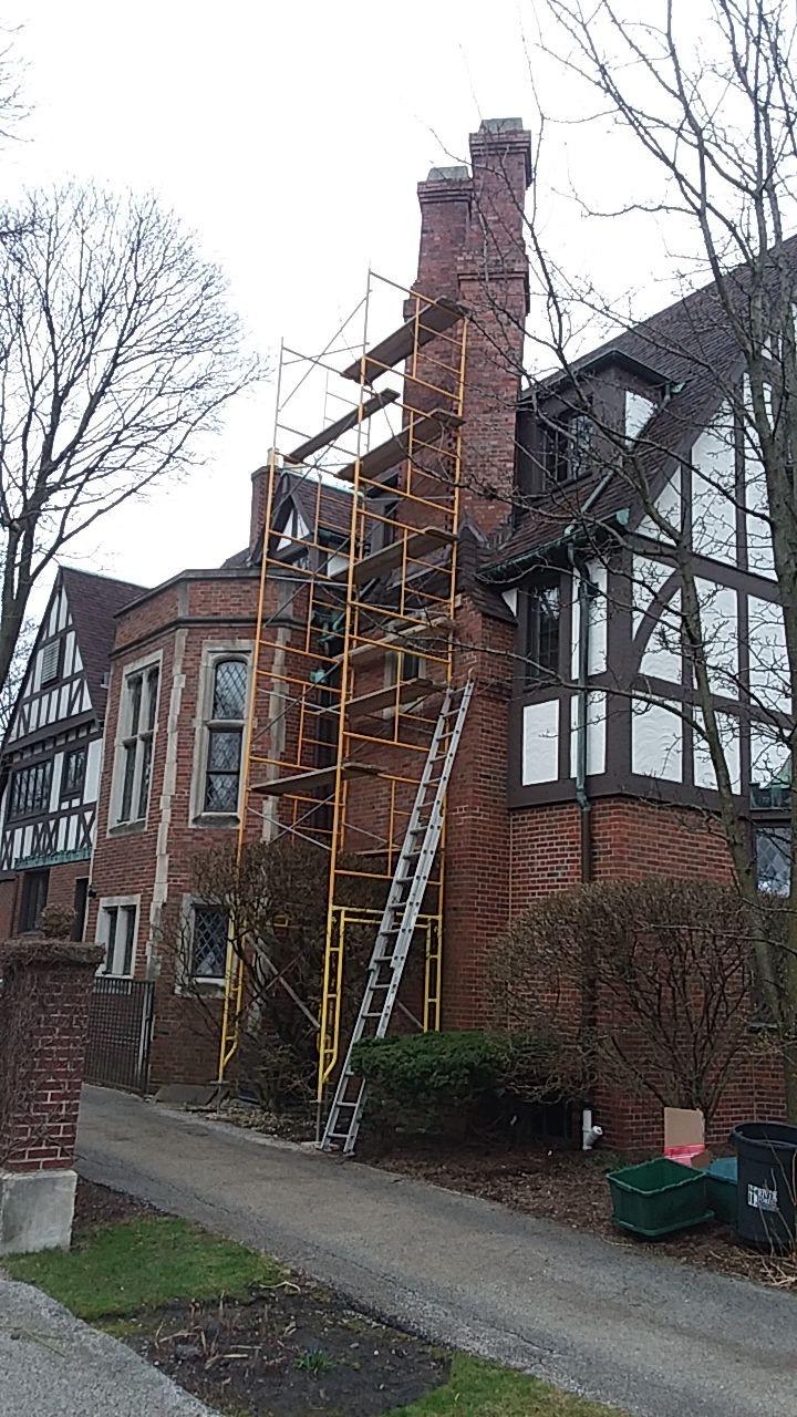 Tall chimney repair. Scaffolding set up for work on a tall chimney.